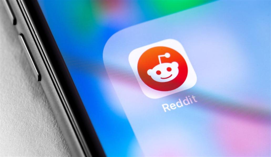 closeup smartphone with Reddit icon app on the screen. Reddit - social news site. Moscow, Russia - June 28, 2019