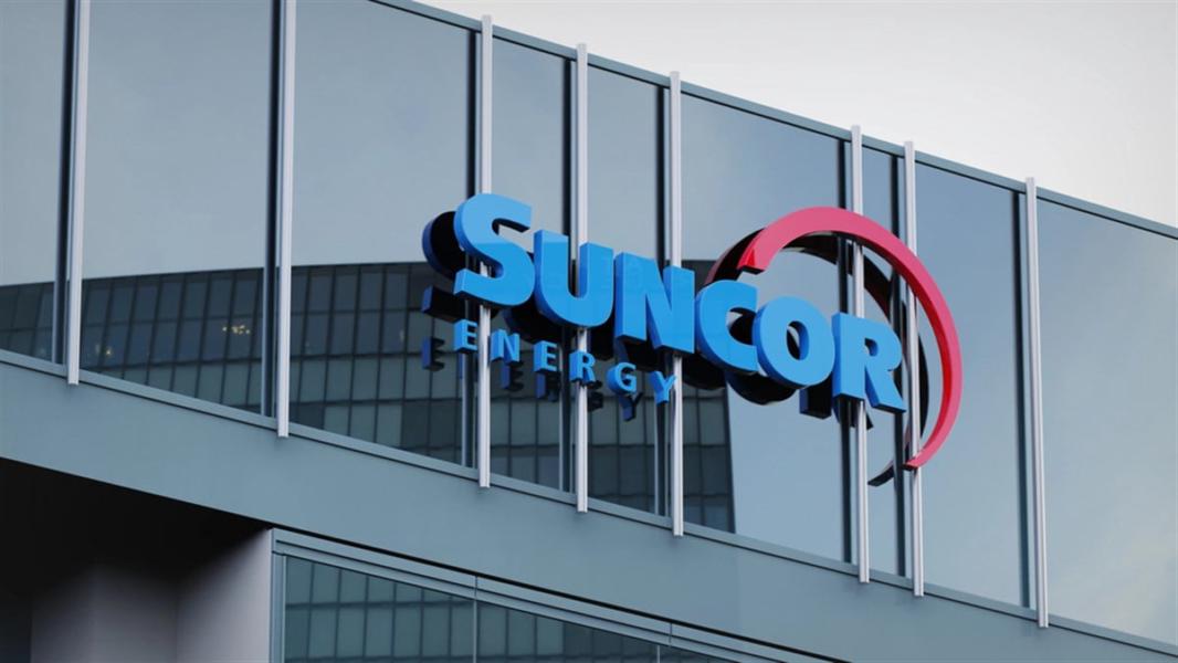 Suncor energy stock data presented on the logo of the office facade editorial