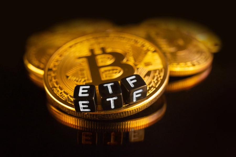 Gold bitcoin with the ETF letters on cubes on top